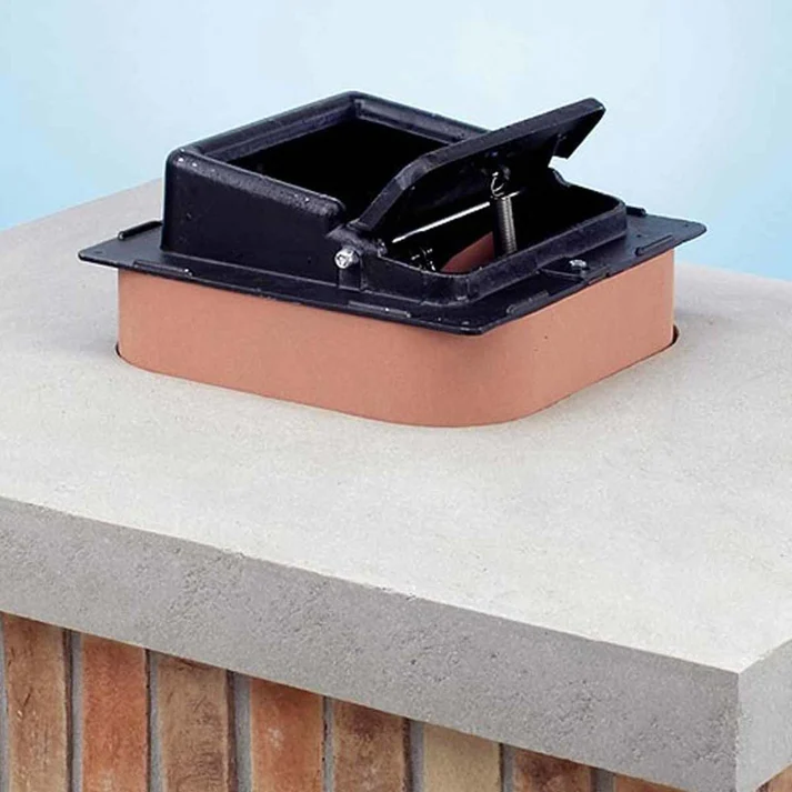 Top-sealing chimney damper installed on a masonry flue